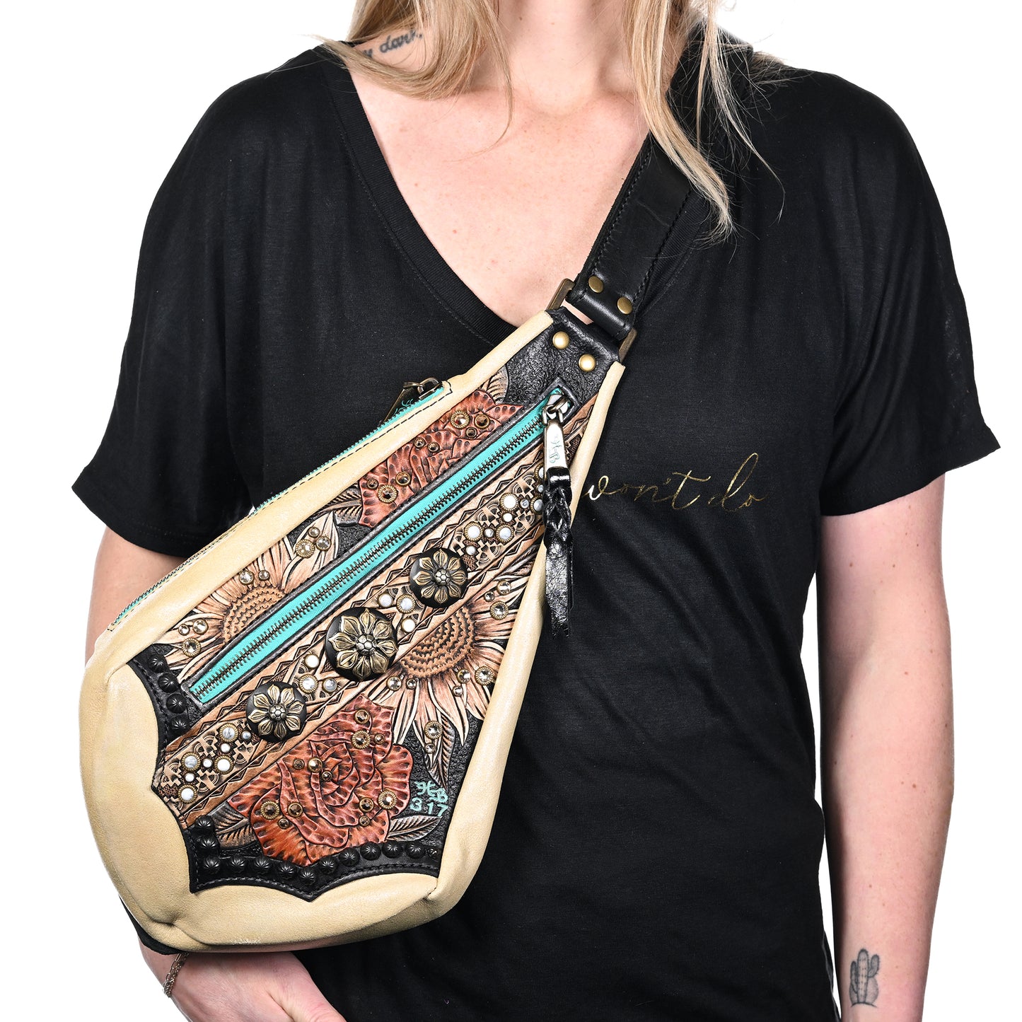 
                  
                    Woman wearing a fyra bag #317 by Heritage Brand with colorful patterns.
                  
                