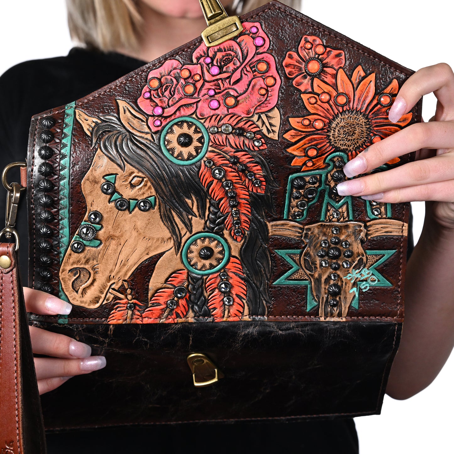 
                  
                    Woman holding a Heritage Brand nola clutch #708 featuring a horse and floral design.
                  
                