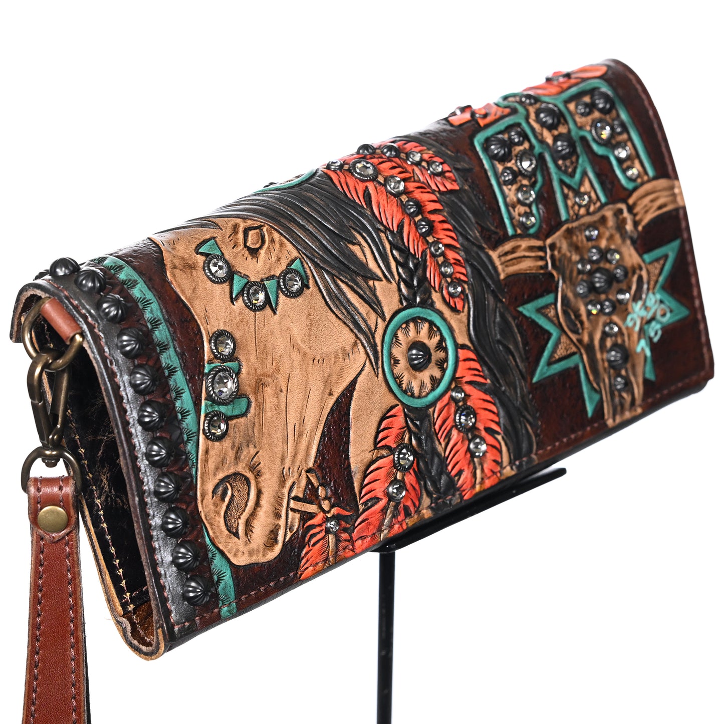 Heritage Brand's nola clutch #708, a hand-painted leather purse with native american-inspired motifs, featuring a horse design and embellished with beads and metal accents.