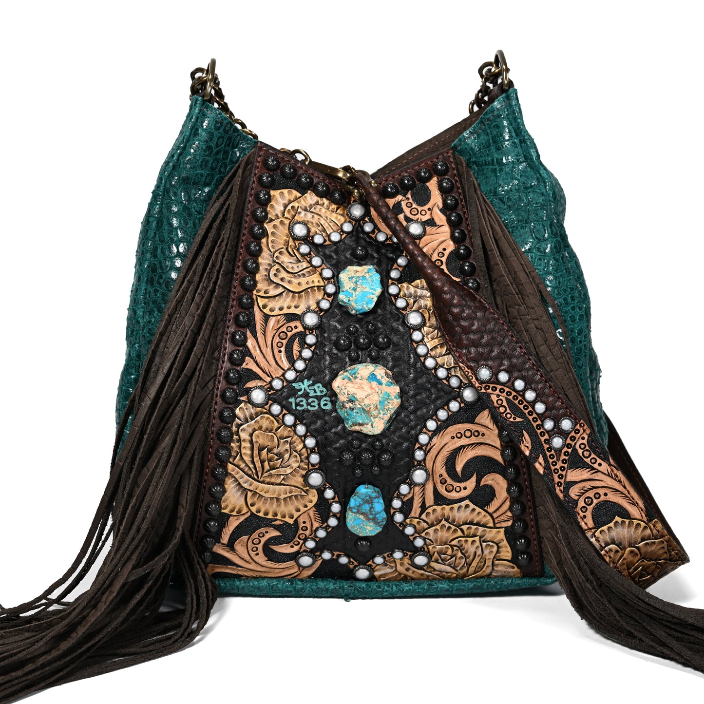 
                  
                    Heritage Brand lyrik bag #1336 with turquoise accents and fringe details on a white background.
                  
                