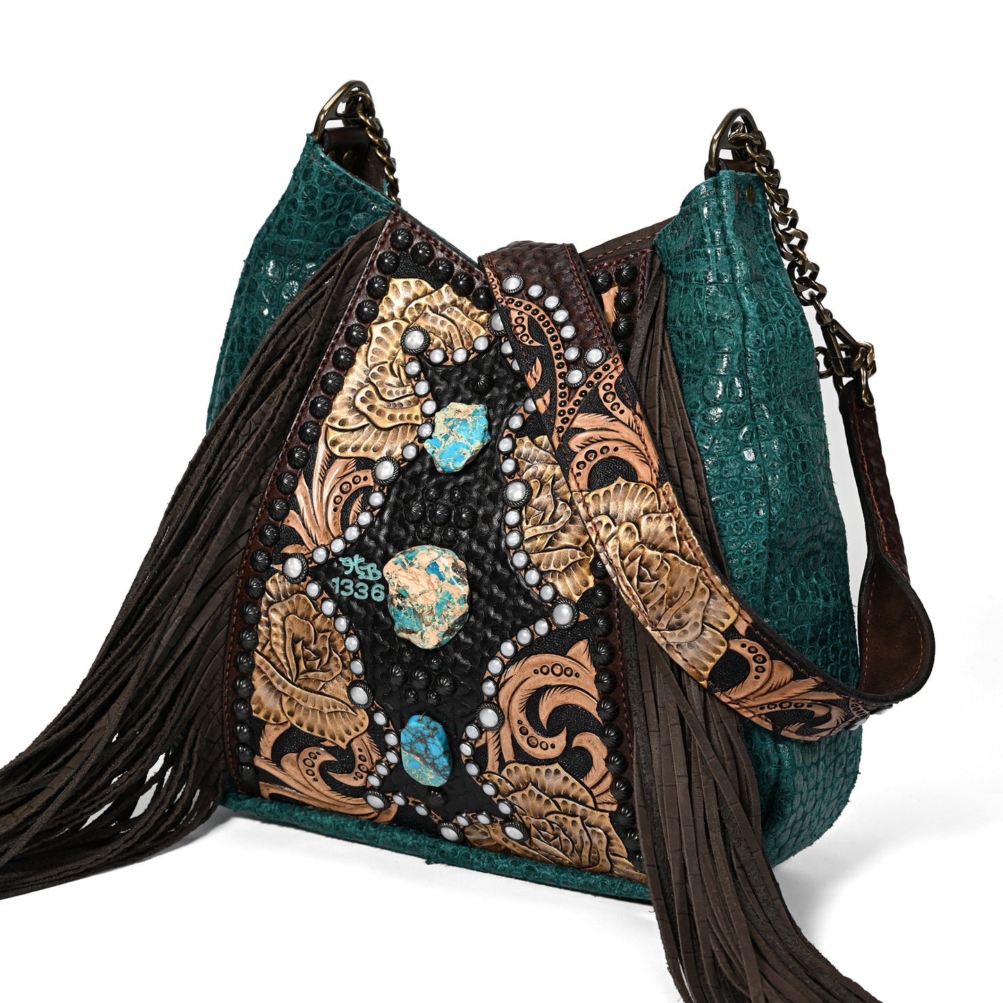 
                  
                    A Heritage Brand lyrik bag #1336 with turquoise embellishments and fringe detailing.
                  
                