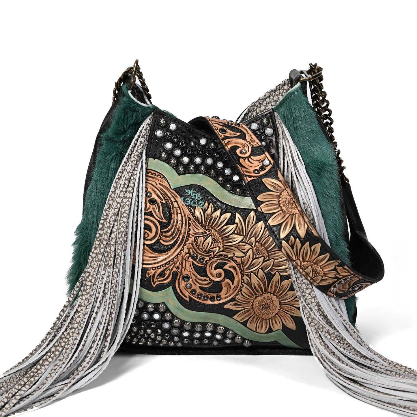 
                  
                    Heritage Brand lyrik bag #1302 with floral patterns, studs, and fringe details.
                  
                