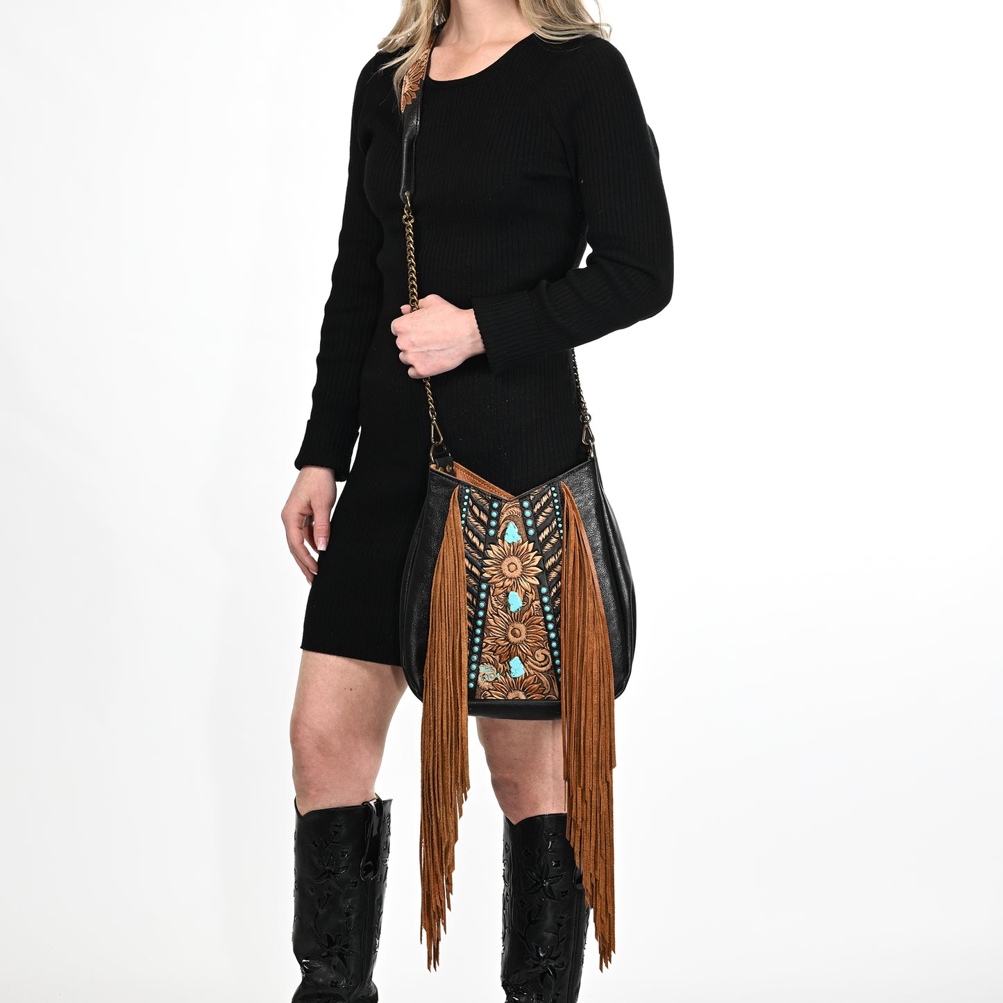 
                  
                    A person wearing a black dress with a Heritage Brand lyrik bag #1304 and knee-high black glasses cases.
                  
                