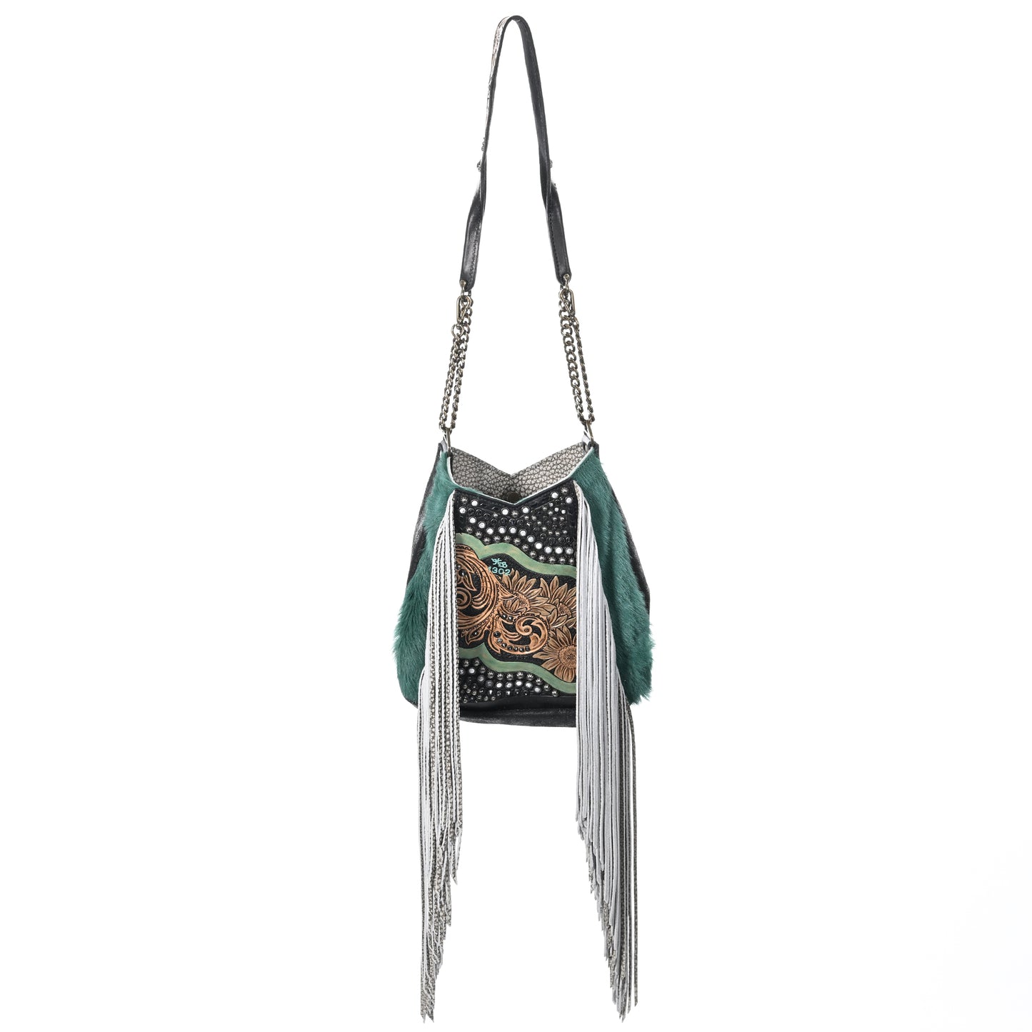 
                  
                    Heritage Brand's lyrik bag #1302, a American west-style shoulder bag with fringe and hand-tooled details on a white background.
                  
                