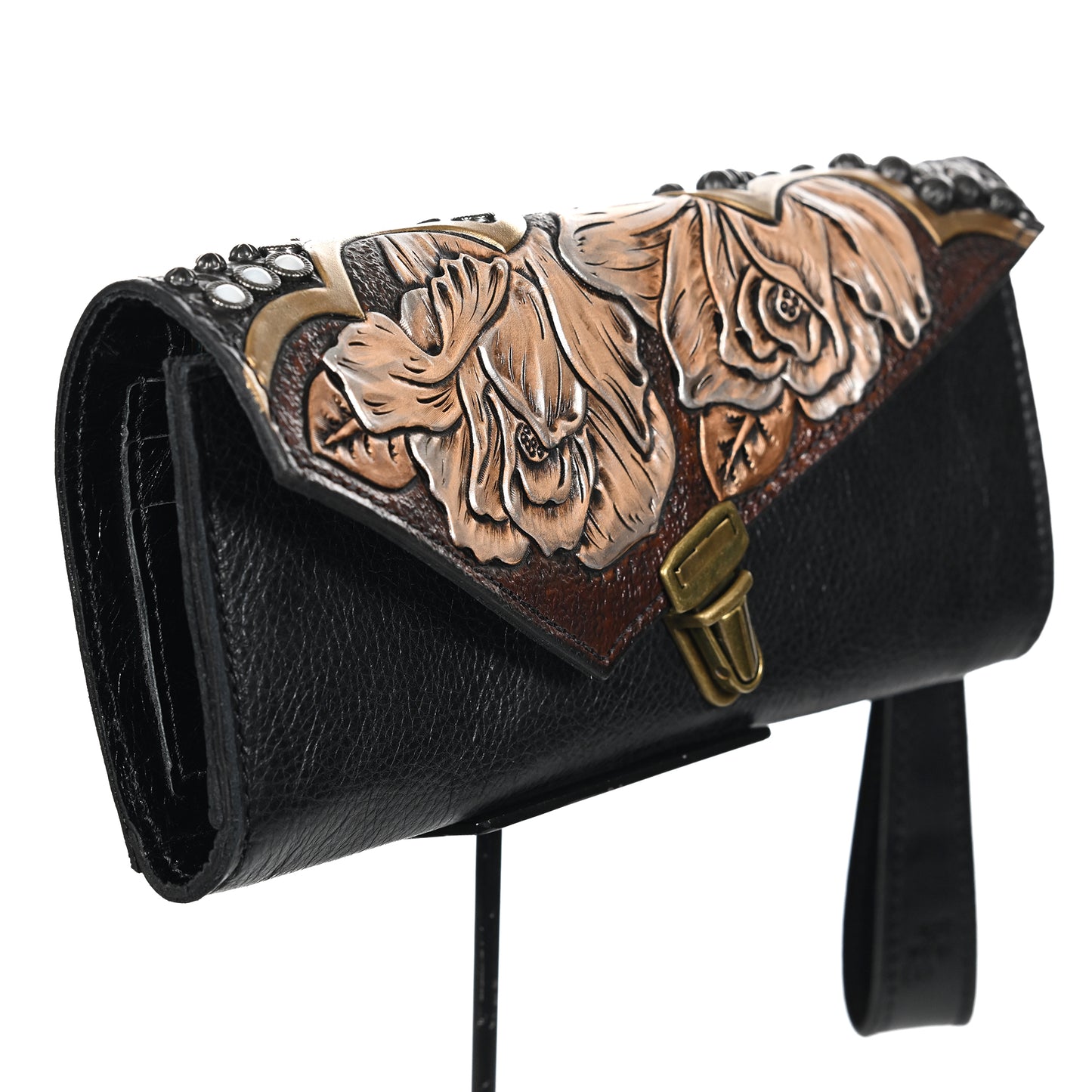 
                  
                    Heritage Brand's nola clutch #1142 with floral embossing and metal clasp.
                  
                