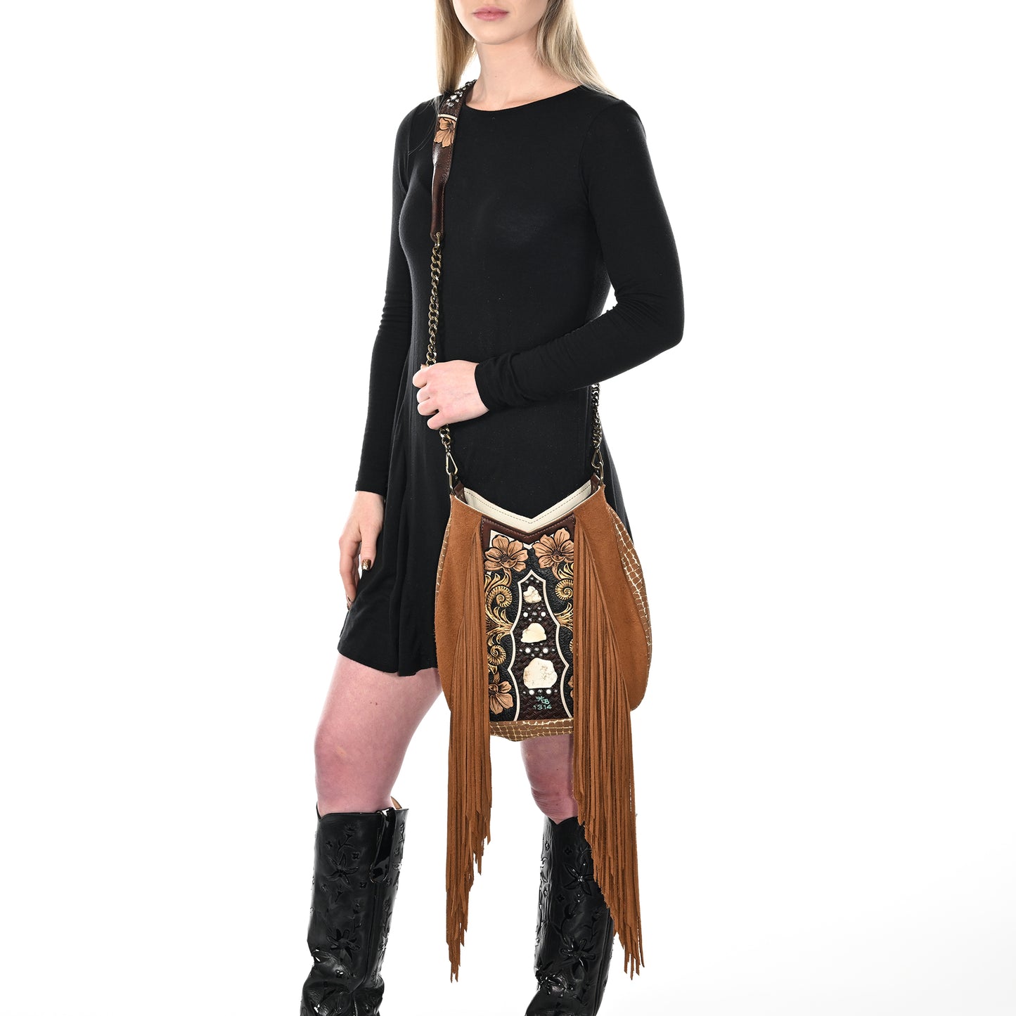 
                  
                    Woman in a black dress with a Heritage Brand lyrik bag #1314 and black knee-high glasses cases.
                  
                