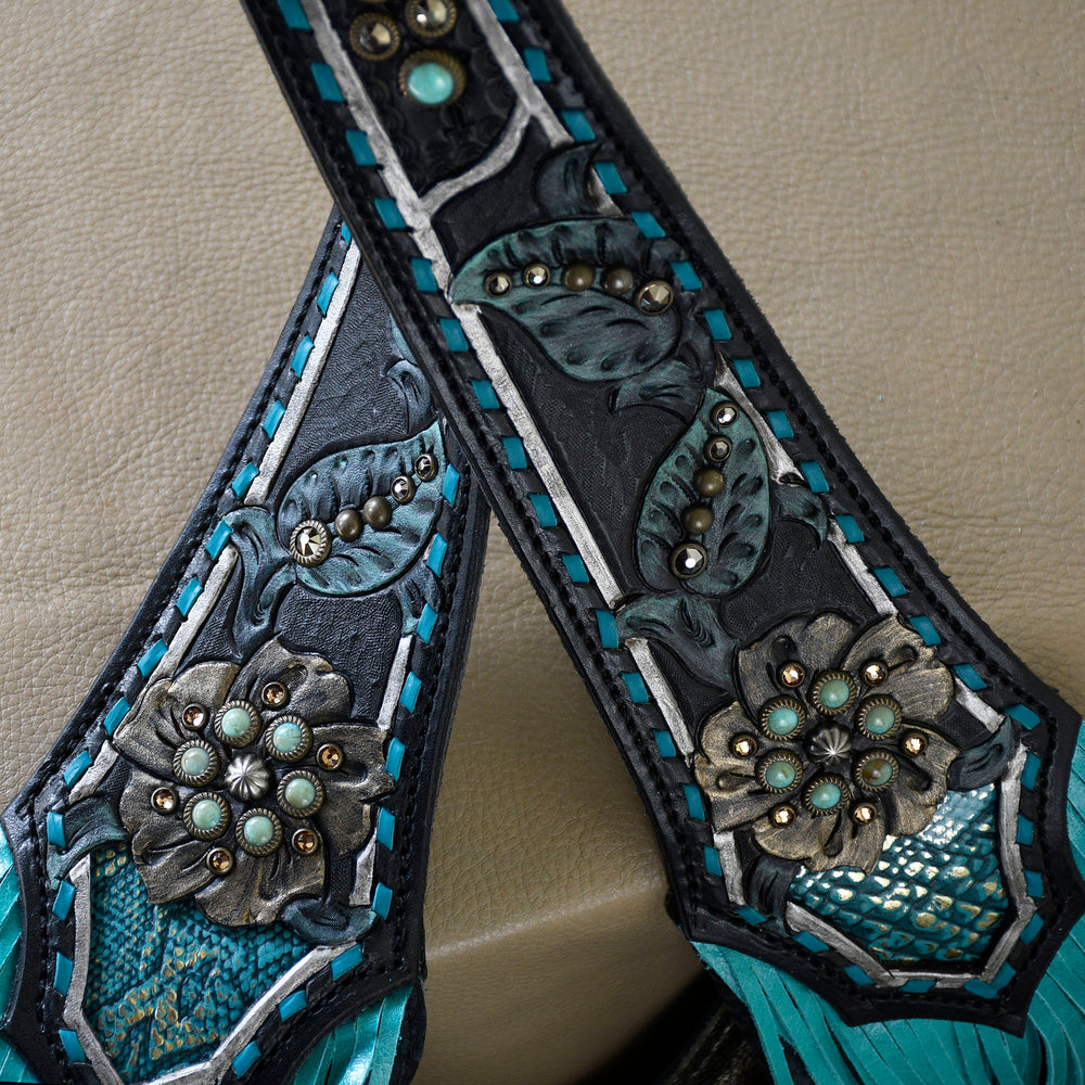 
                  
                    Close-up of a Heritage Brand Marilyn Bag #18 with turquoise inlay and ornate metal embellishments.
                  
                