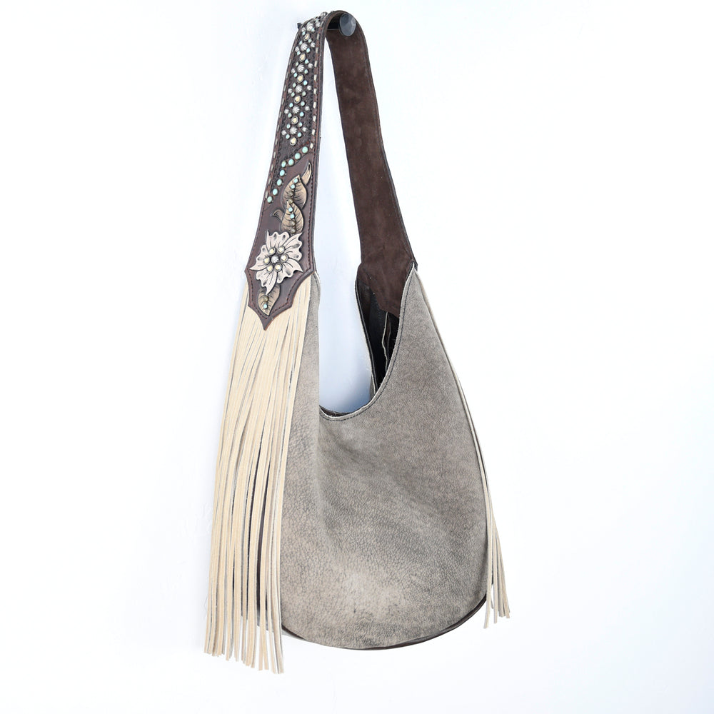 
                  
                    American west-style Heritage Brand Marilyn bag #696 with tassel detail against a white background.
                  
                