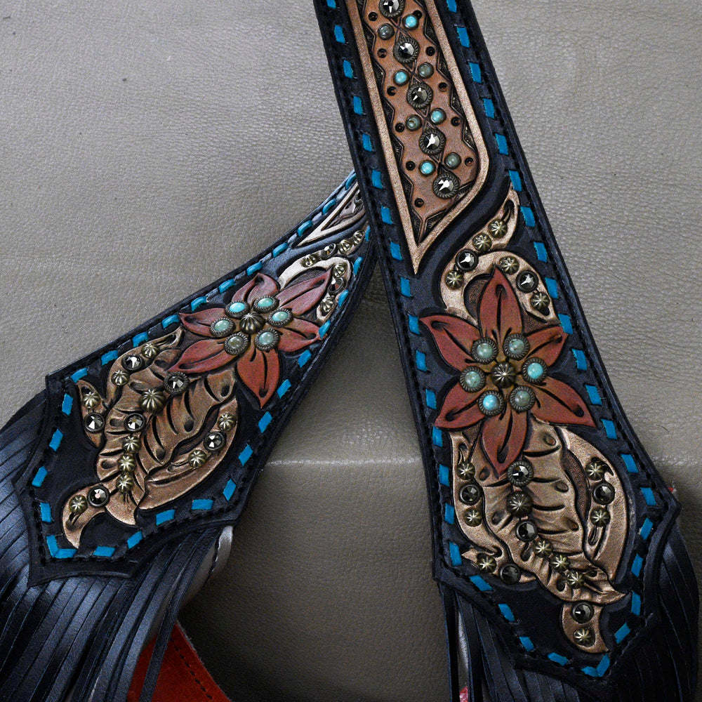 
                  
                    Close-up of a pair of Heritage Brand marilyn bag #31 with floral embossing and metal stud accents.
                  
                