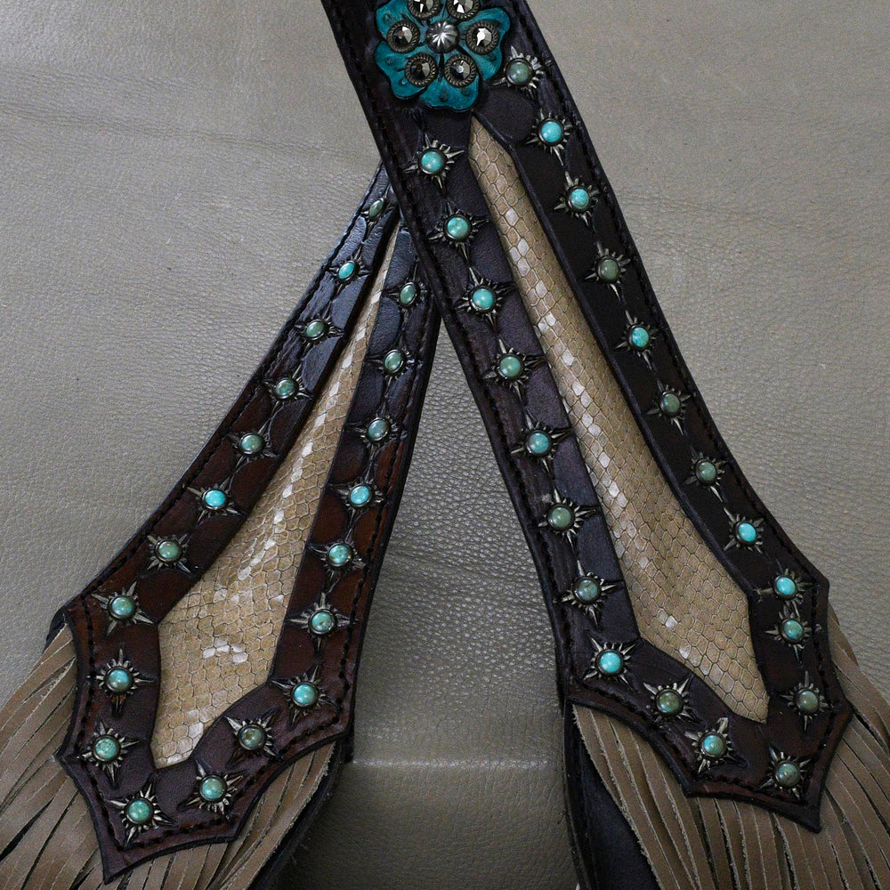 
                  
                    Embellished strap featuring turquoise inlays and studded accents, like the Marilyn Bag #1248 by Heritage Brand.
                  
                