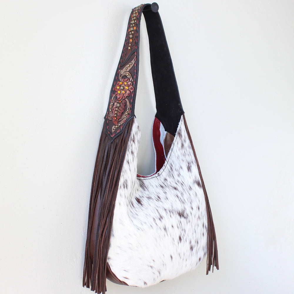 
                  
                    Heritage Brand Marilyn Bag #1196 with faux fur and fringe detailing hanging against a white background.
                  
                
